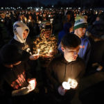 
              Mourners attend a candlelight vigil for Alexandria Verner at the Clawson High School football field in Clawson, Mich., Tuesday, Feb. 14, 2023.  Verner was among the students killed after a gunman opened fire on the campus of Michigan State University Monday night.  (AP Photo/Paul Sancya)
            