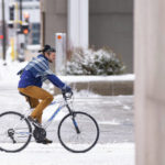 
              A biker makes their way down S. Seventh St. in the snow on Wednesday, Feb. 22, 2023, in downtown Minneapolis. (Alex Kormann/Star Tribune via AP)
            