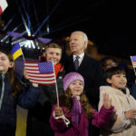 
              President Joe Biden stands with children after delivering a speech marking the one-year anniversary of the Russian invasion of Ukraine, Tuesday, Feb. 21, 2023, at the Royal Castle Gardens in Warsaw. (AP Photo/ Evan Vucci)
            