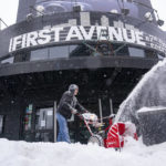 
              Bryan Erickson clears snow in front of First Avenue Thursday, Feb. 23, 2023 in Minneapolis. Dangerous winter weather is ravaging the nation from California through the northern Plains. (Alex Kormann/Star Tribune via AP)
            