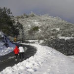 
              People walk up Summit Road while visiting Mount Diablo State Park in Walnut Creek, Calif., Monday, Feb. 27, 2023. In California, the National Weather Service said a series of winter storm systems will continue moving into the state through Wednesday after residents got a brief break from severe weather Sunday. (AP Photo/Godofredo A. Vásquez)
            