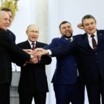 FALTA 13, 28 FILE - From left, Moscow-appointed head of Kherson Region Vladimir Saldo, Moscow-appointed head of Zaporizhzhia region Yevgeny Balitsky, Russian President Vladimir Putin, Denis Pushilin, leader of self-proclaimed of the Donetsk People's Republic and Leonid Pasechnik, leader of self-proclaimed Luhansk People's Republic pose for a photo during a ceremony to sign the treaties for four regions of Ukraine to join Russia, at the Kremlin in Moscow, Friday, Sept. 30, 2022. The signing of the treaties making the four regions part of Russia follows the completion of the Kremlin-orchestrated "referendums." (Dmitry Astakhov, Sputnik, Government Pool Photo via AP, File)