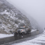 
              A snow plow truck drives along the Angeles Forest Highway near La Canada Flintridge, Calif., Thursday, Feb. 23, 2023. For the first time since 1989, the National Weather Service issued a blizzard warning for the Southern California mountains. (AP Photo/Jae C. Hong)
            