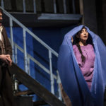 
              Karin Mushegain, right, who portrays Mariam, emerges from a burqa given to her by John Moore, who portrays Rasheed, during a dress rehearsal for the opera "A Thousand Splendid Suns," in Seattle, on Wednesday, Feb. 22, 2023. Kabul-born author Khaled Hosseini, the book’s author who lives in California, had hoped the story would become a relic of the past, maybe a "cautionary tale.” But instead, he said, “what’s going on with women today is a cruel deja vu.” (AP Photo/Stephen Brashear)
            