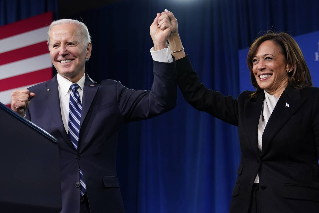 President Joe Biden and Vice President Kamala Harris stand on stage at the Democratic National Comm...