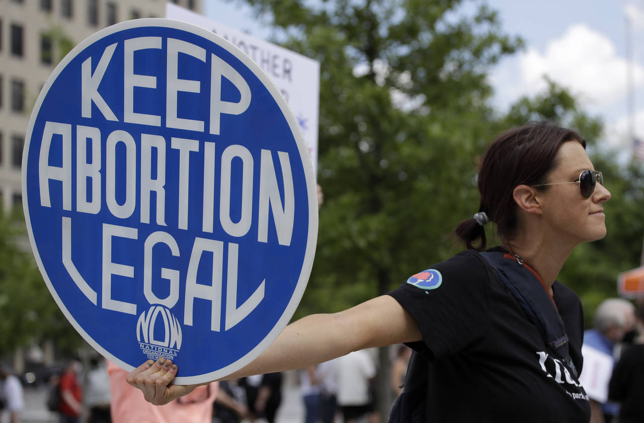 FILE - Abortion-rights demonstrator holds a sign during a rally on May 14, 2022, in Chattanooga, Te...
