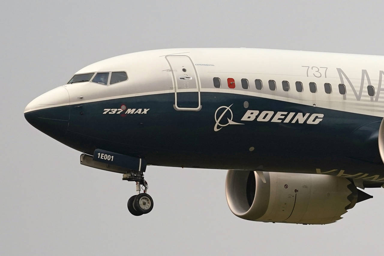 FILE - A Boeing 737 Max jet prepares to land at Boeing Field following a test flight in Seattle. (A...