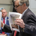 
              Prosecutor John Meadors shows evidence to the jury in the Alex Murdaugh trial at the Colleton County Courthouse in Walterboro, S.C., on Wednesday, Feb. 15, 2023. The 54-year-old attorney is standing trial on two counts of murder in the shootings of his wife and son at their Colleton County, S.C., home and hunting lodge on June 7, 2021. (Grace Beahm Alford/The Post And Courier via AP, Pool)
            