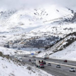 
              Snow surrounds the I-5 freeway through Gorman, Calif., Monday, Feb. 27, 2023. A winter storm warning is in effect for the area through Wednesday. (David Crane/The Orange County Register via AP)
            