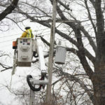 
              A DTE contractor crew works on a power line, Monday, Feb. 27, 2023, in northwest Detroit. Some Michigan residents faced a fourth straight day without power as crews worked to restore electricity to more than 165,000 homes and businesses in the Detroit area after last week's ice storm. (AP Photo/Carlos Osorio)
            