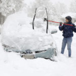 
              Cathy Morgan-Mace cleans snow and ice off her family's car during a snowstorm in Salt Lake City, Utah, on Wednesday, Feb. 22, 2023.  A brutal winter storm knocked out power in California, closed interstate highways from Arizona to Wyoming and prompted more than 1,200 flight cancellations Wednesday — and the worst won't be over for several days. (Kristin Murphy/The Deseret News via AP)
            