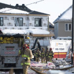 
              Firefighters from the Ottawa Fire Service work the scene of an early morning gas leak explosion in east Ottawa, Ontario, on Monday, Feb. 13, 2023. (Spencer Colby/The Canadian Press via AP)
            