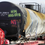 
              A tank car sits on a trailer as the cleanup of portions of a Norfolk Southern freight train that derailed over a week ago continues in East Palestine, Ohio, Wednesday, Feb. 15, 2023. (AP Photo/Gene J. Puskar)
            