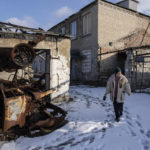 
              Valentyna Mozgova, 55, lab medic walks in the yard of a hospital which was damaged by Russian shelling in Krasa nohorivka, Ukraine, Sunday, Feb. 19, 2023. (AP Photo/Evgeniy Maloletka)
            