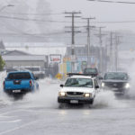 
              Cars move through flooded roads in the northern New Zealand city of Whangarei as Tropical Cyclone Gabrielle hits the Northland, Sunday, Feb. 12, 2023. New Zealand's national carrier has canceled dozens of flights as Aucklanders brace for a deluge from Cyclone Gabrielle, two weeks after a record-breaking storm swamped the nation's largest city and killed several people. (Michael Cunningham/Northern Advocate via AP)
            