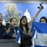 
              Supporters of Nicaraguan political prisoners chant at Washington Dulles International Airport, in Chantilly, Va., on Thursday, Feb. 9, 2023. Some 222 inmates considered by many to be political prisoners of the government of Nicaraguan President Daniel Ortega arrived at Washington after an apparently negotiated release. (AP Photo/Jose Luis Magana)
            
