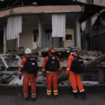 
              Members of the British rescue team search in a destroyed house in Antakya, southern Turkey, Thursday, Feb. 9, 2023. Tens of thousands of people who lost their homes in a catastrophic earthquake huddled around campfires in the bitter cold and clamored for food and water Thursday, three days after the temblor hit Turkey and Syria. (AP Photo/Khalil Hamra)
            