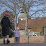 
              Viktoria Kovalenko, 34, and her daughter Varvara go for a walk in a village in Kent, Thursday, Feb. 9, 2023. Kovalenko chose to come to England not only because it offered her refuge from the war in Ukraine. It was also a chance for her to escape from her harrowing memories of losing her family in a shell attack. (AP Photo/Frank Augstein)
            