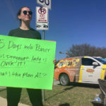 
              Katy Maganella, 37, protests in front of an Austin Energy truck in her neighborhood in Austin, Texas, Sunday, Feb. 5, 2023. Thousands of Austin residents remained without power days after an ice storm knocked out electricity to nearly a third of the city's customers. (AP Photo/Paul Weber)
            