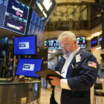 
              Traders work on the floor at the New York Stock Exchange in New York, Wednesday, Feb. 22, 2023. (AP Photo/Seth Wenig)
            