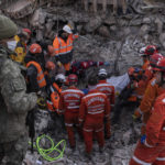 
              CAPTION CORRECTS LENGTH OF TIME - A Turkish soldier, left, as rescue workers of the Search and rescue unit of the Turkish Gendarmerie General Command, JAK, work to pull 23-year-old Huseyin Seferoglou from the rubble of a collapsed building in Antakya, Turkey, Sunday, Feb. 12, 2023. Six days after two powerful earthquakes hours apart caused scores of buildings to collapse, killing thousands of people and leaving millions homeless, rescuers were still pulling unlikely survivors from the ruins. (AP Photo/Petros Giannakouris)
            