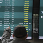 
              A passenger views information boards at Minneapolis-Saint Paul International Airport showing canceled flights ahead of an impending snow storm forecasted to hit the Twin Cities later in the day Wednesday, Feb. 22, 2023 in St. Paul, Minn. (Anthony Souffle/Star Tribune via AP)
            