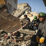 
              Turkish rescue workers stand by a collapsed building in Adiyaman, southern Turkey, Saturday, Feb. 11, 2023. Rescuers in Turkey miraculously continued to pull earthquake survivors out of the rubble on Saturday. The unlikely rescues, coming over four days after Monday's 7.8-magnitude quake brought down thousands of buildings in Turkey and Syria, offered fleeting moments of joy amid a catastrophe that has killed nearly 24,000 people, injured at least 80,000 others and left millions homeless.(AP Photo/Emrah Gurel)
            