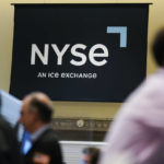 
              FILE - An NYSE sign is seen on the floor at the New York Stock Exchange in New York, Wednesday, June 15, 2022. (AP Photo/Seth Wenig, File)
            