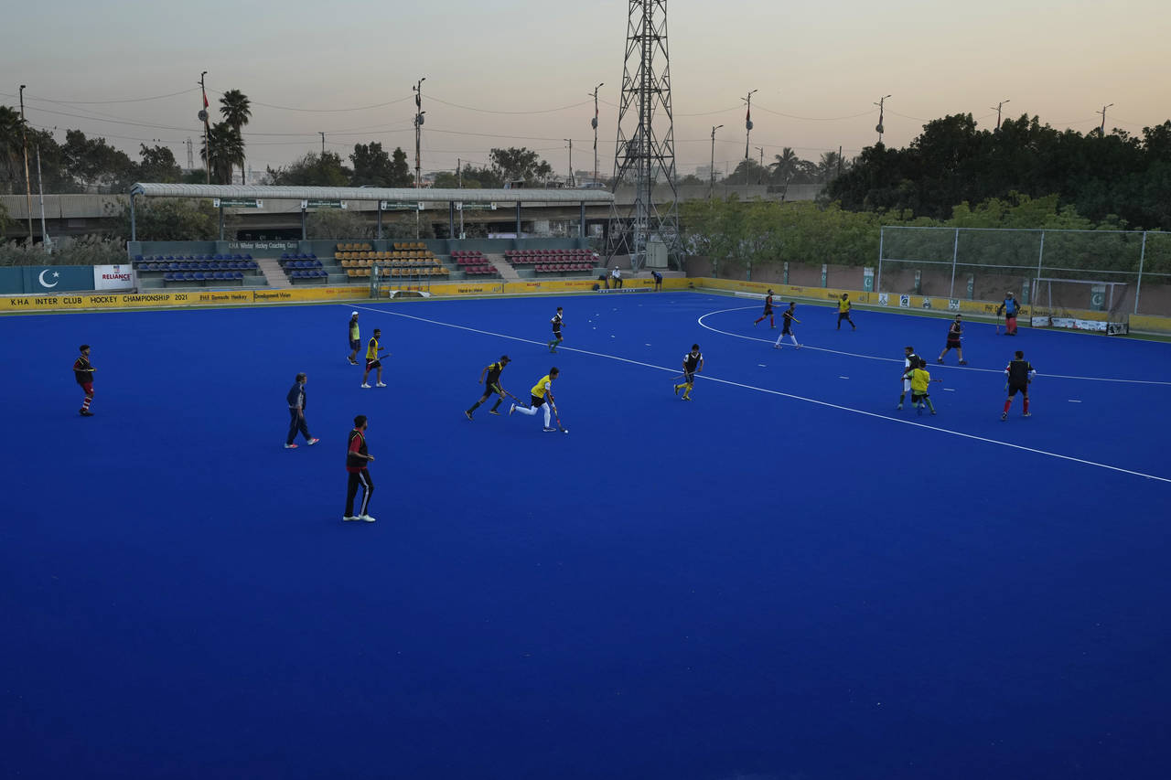 Field hockey players of a local club attend a training session, in Karachi, Pakistan, Sunday, Nov. ...