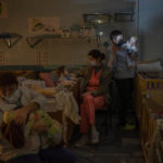 
              FILE - Hospital staff take care of orphaned children at the children's regional hospital maternity ward in Kherson, southern Ukraine, Tuesday, Nov. 22, 2022. (AP Photo/Bernat Armangue, File)
            