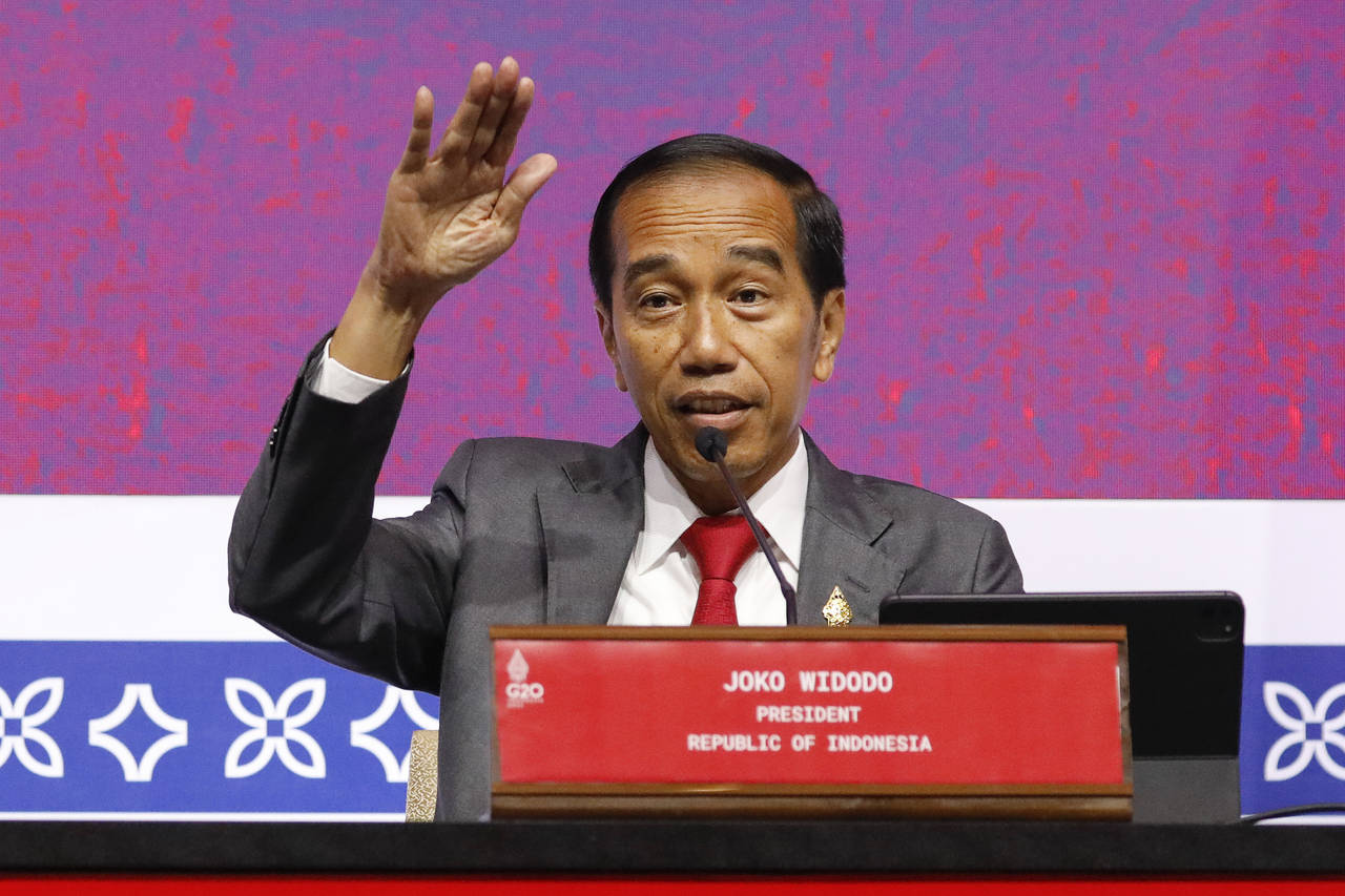 FILE - Indonesian President Joko Widodo gestures as he speaks during a press conference at the G20 ...