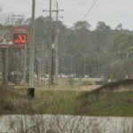 
              Traffic from Jackson, Miss., crosses over the Pearl River, one of the proposed boundaries for the enlarged Capital Complex Improvement District, Feb. 14, 2023. A bill being considered by the majority-white Mississippi Legislature would expand the patrol territory for the state-run Capitol Police within the majority-Black city and would create a court system with appointed rather than elected judges. (AP Photo/Rogelio V. Solis)
            