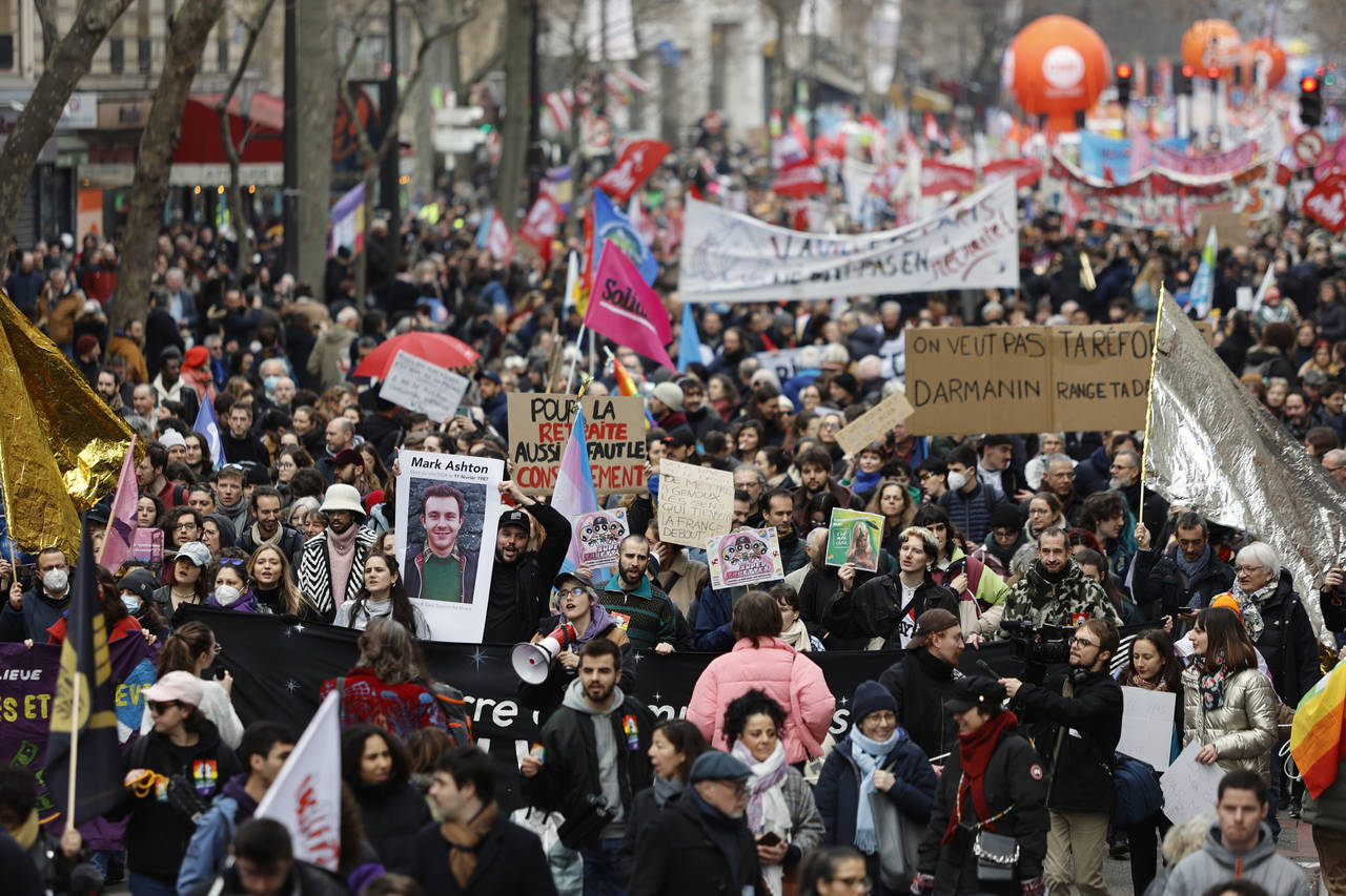 Protesters march during a demonstration against plans to push back France's retirement age, in Pari...