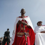 
              A Maasai man joins others at a national day of prayer event held at Nyayo stadium in the capital Nairobi, Kenya, Tuesday, Feb. 14, 2023. With the prospect of a sixth consecutive failed rainy season in the east and Horn of Africa, Kenya's president is hoping the heavens will finally open with the help of a national day of mass prayer. (AP Photo/Brian Inganga)
            