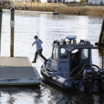 
              A man jumps from a Navy boat to secure it to a dock on the InterCoastal Waterway in North Myrtle Beach, S.C., Tuesday, Feb. 7, 2023.  Using underwater drones, warships and inflatable vessels, the Navy is carrying out an extensive operation to gather all of the pieces of the massive Chinese spy balloon a U.S. fighter jet shot down off the coast of South Carolina on Saturday.  (AP Photo/Nell Redmond)
            