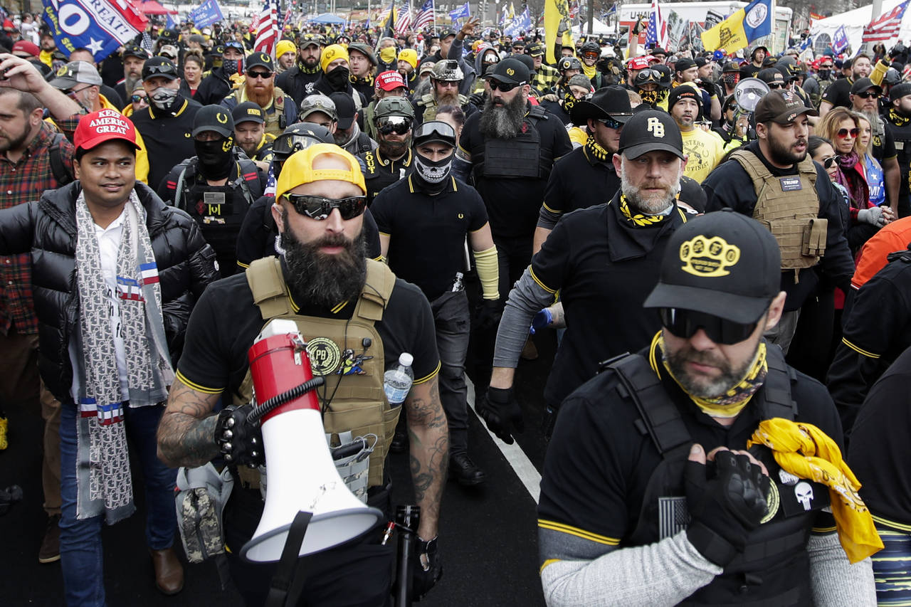 FILE - Proud Boys member Jeremy Joseph Bertino, second from left, joins other supporters of Preside...