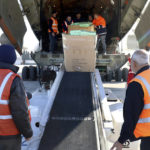 
              In this photo released by the official Syrian state news agency SANA, workers unload humanitarian aid sent from Arminia, for Syria following a devastating earthquake, at the airport in Aleppo, Syria, Thursday, Feb. 9, 2023. Rescuers pulled more survivors from beneath the rubble of collapsed buildings Thursday, but hopes were starting to fade of finding many more people alive more than three days after a catastrophic earthquake and series of aftershocks hit Turkey and Syria. (SANA via AP)
            