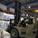 
              A forklift driver loads assistance packages to be sent for earthquake hit areas of Turkey, at Al-Udeid Air Base in Doha, Qatar, Tuesday, Feb. 7, 2023. (AP Photo/Kamran Jebreili)
            