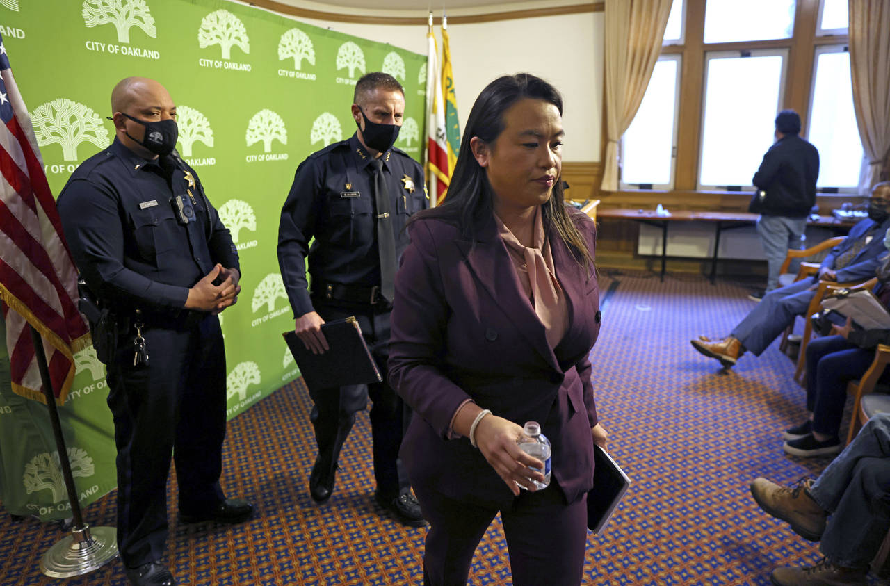 Oakland Mayor Sheng Thao leaves after announcing the firing of Oakland police Chief LeRonne Armstro...