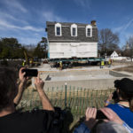 
              The Bray School is aligned with a set foundation at its new location in Colonial Williamsburg in Williamsburg, Va. on Friday, Feb. 10, 2023 after it was moved from the William & Mary campus. (Billy Schuerman/The Virginian-Pilot via AP)
            