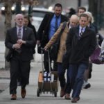 
              Michael J. Allen, front, district attorney for Colorado's Fourth Judicial District, leads attorneys into the El Paso County courthouse for a preliminary hearing for the alleged shooter in the Club Q mass shooting Wednesday, Feb. 22, 2023, in Colorado Springs, Colo. (AP Photo/David Zalubowski)
            