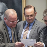 
              From left, South Carolina Law Enforcement Division special agent David Owen, attorney general Alan Wilson and prosecutor John Meadors look over notes during Alex Murdaugh's double murder trial at the Colleton County Courthouse on Tuesday, Feb. 7, 2023, in Walterboro, S.C. The 54-year-old attorney is standing trial on two counts of murder in the shootings of his wife and son at their Colleton County home and hunting lodge on June 7, 2021. (Andrew J. Whitaker/The Post And Courier via AP, Pool)
            
