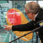 
              Ohio Governor Mike DeWine points to a map of East Palestine, Ohio that indicates the area that has been evacuated as a result of Norfolk and Southern train derailment, after touring the site, Monday, Feb. 6, 2023, in East Palestine, Ohio. (AP Photo/Gene J. Puskar)
            