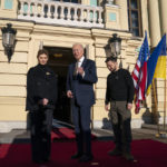 
              President Joe Biden, center, poses with Ukrainian President Volodymyr Zelenskyy, right, and Olena Zelenska, left, spouse of President Zelenskyy, at Mariinsky Palace during an unannounced visit in Kyiv, Ukraine, Monday, Feb. 20, 2023. (AP Photo/Evan Vucci, Pool)
            