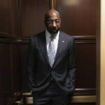 
              Sen. Raphael Warnock, D-Ga., takes the elevator from his office after an interview with The Associated Press on Capitol Hill, Wednesday, Feb. 1, 2023, in Washington. (AP Photo/Manuel Balce Ceneta)
            