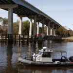 
              A Navy boat prepares to dock on the InterCoastal Waterway in North Myrtle Beach, S.C., Tuesday, Feb. 7, 2023.  Using underwater drones, warships and inflatable vessels, the Navy is carrying out an extensive operation to gather all of the pieces of the massive Chinese spy balloon a U.S. fighter jet shot down off the coast of South Carolina on Saturday.  (AP Photo/Nell Redmond)
            