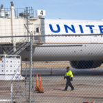
              Members of the ground crew secure the site after a United airlines flight made an emergency landing at the Lincoln airport on Saturday, Feb. 4, 2023. The flight headed from Chicago to Las Vegas made an unplanned stop in Nebraska on Saturday after the pilot reported engine problems.(Kenneth Ferriera/Lincoln Journal Star via AP)
            