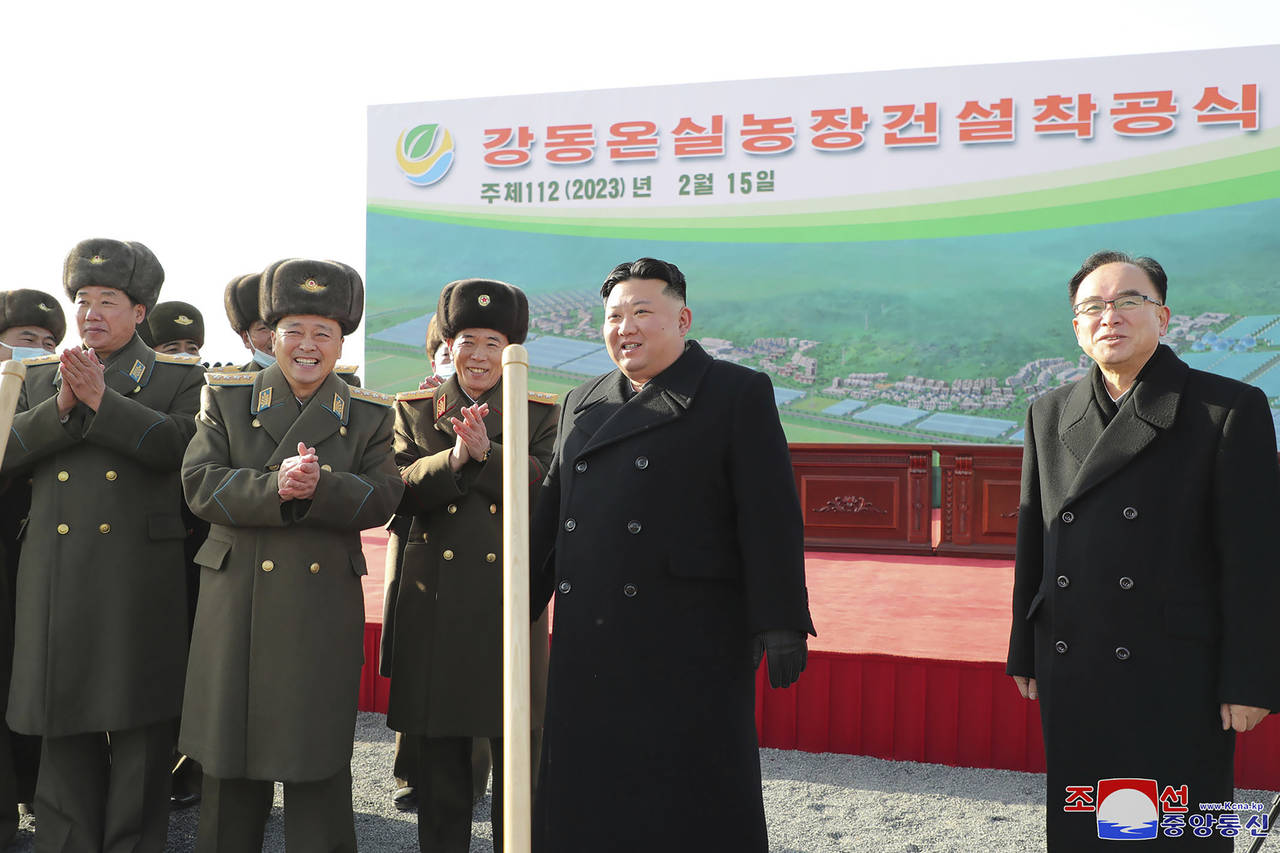 In this photo provided by the North Korean government,  North Korean leader Kim Jong Un, second rig...