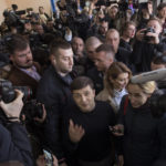 
              FILE - Ukrainian comedian and presidential candidate Volodymyr Zelenskyy, arrives at a polling station, during the presidential elections in Kyiv, Ukraine, Sunday, March. 31, 2019.  A year ago, with Russian forces bearing down on Ukraine’s capital, Western leaders feared for the life of President Volodymyr Zelenskyy and the U.S. offered him an escape route. Zelenskyy declined, declaring his intent to stay and defend Ukraine’s independence.  (AP Photo/Emilio Morenatti, File)
            