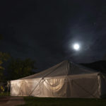 
              The moon shines over a large tent housing about two dozen individuals partaking in an ayahuasca ceremony, on Sunday, Oct. 16, 2022, in Hildale, Utah. Hummingbird Church, which hosted the weekend ayahuasca retreat, is part of a growing global trend in which people are turning to ayahuasca to treat an array of health problems after conventional medications and therapy failed them. (AP Photo/Jessie Wardarski)
            